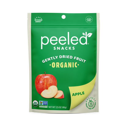 Peeled Snacks Gently Dried Fruit Organic Apple product bag in green and cream, featuring a whole red apple with two slices, and prominent "No Sugar Added" "USDA Organic" and "Non-GMO Project Verified" labels