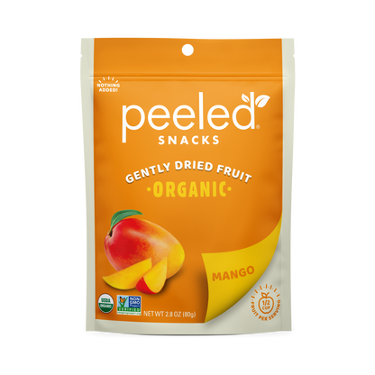 Product photo of a vibrant orange and white Peeled Snacks Gently Dried Organic Mango pouch displaying a ripe mango and slices, marked with USDA Organic and Non-GMO Project Verified seals